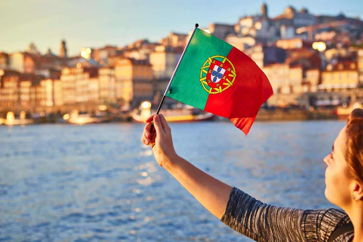 A Portuguese citizen waves the national flag of Portugal